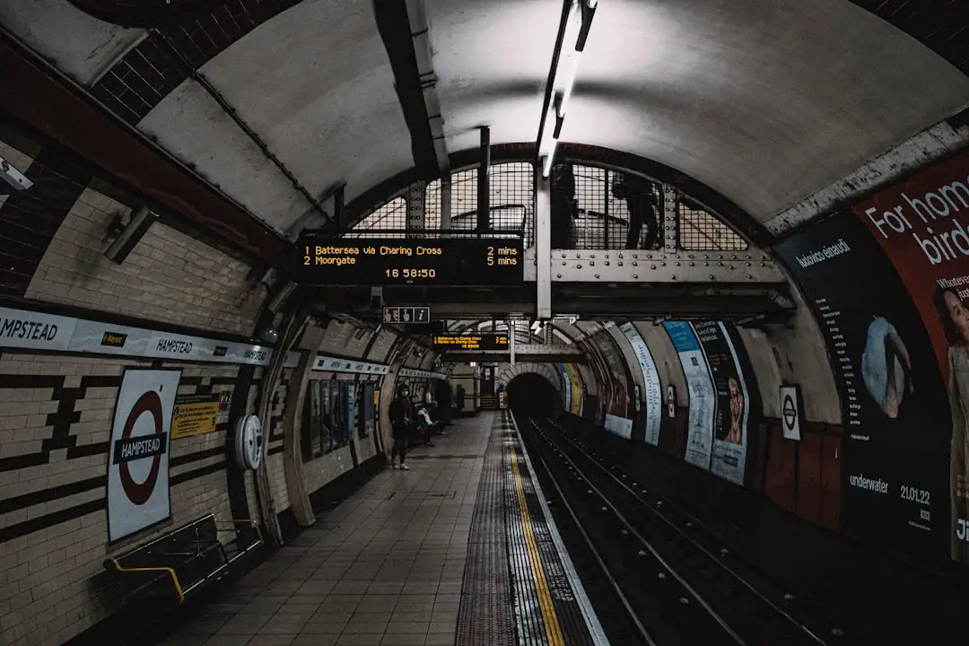 a subway station with a train on the tracks